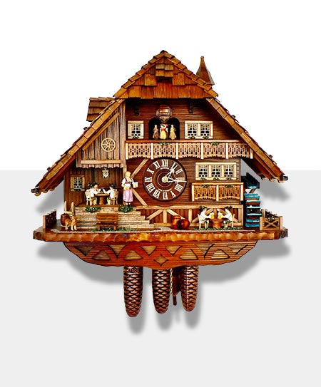Carved cuckoo clock with a typical situation from the Black Forest on a gray background.